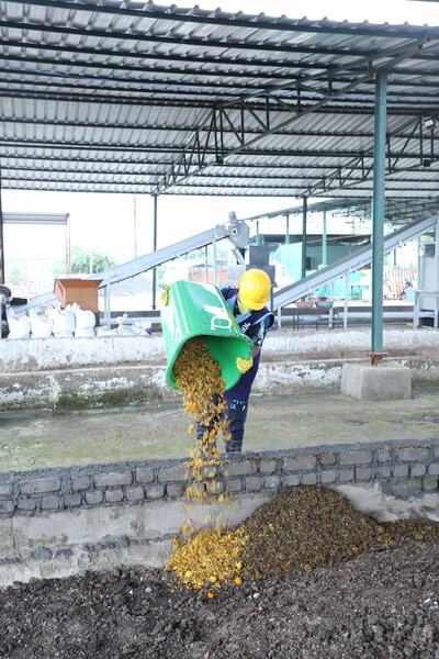 Compost going into the curing pit